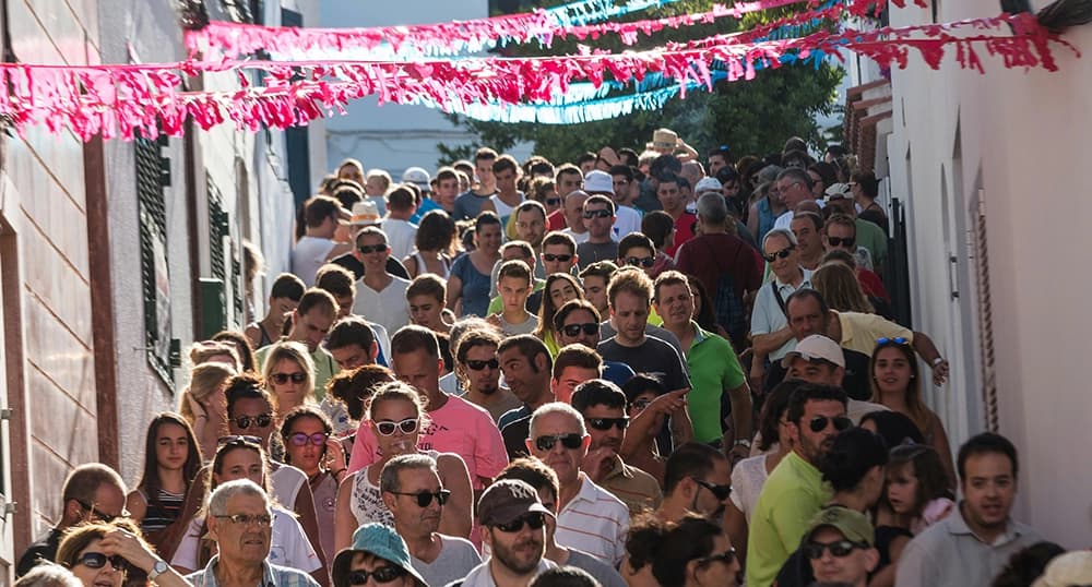 Crowd of people in Es Mercadal, Spain.