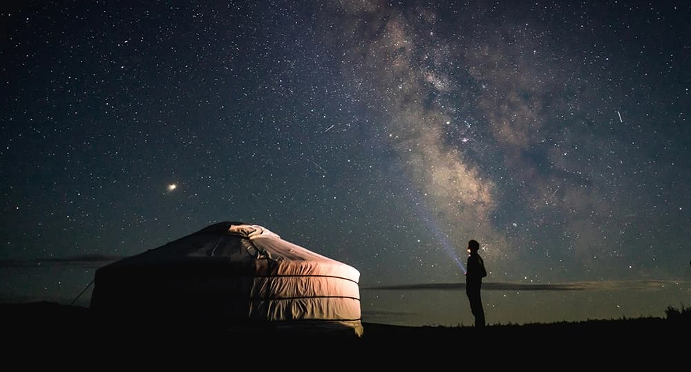 Stargazing outside of tent.