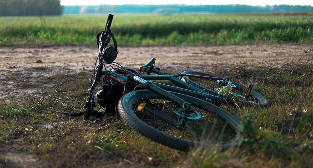 Bike laying on the ground.