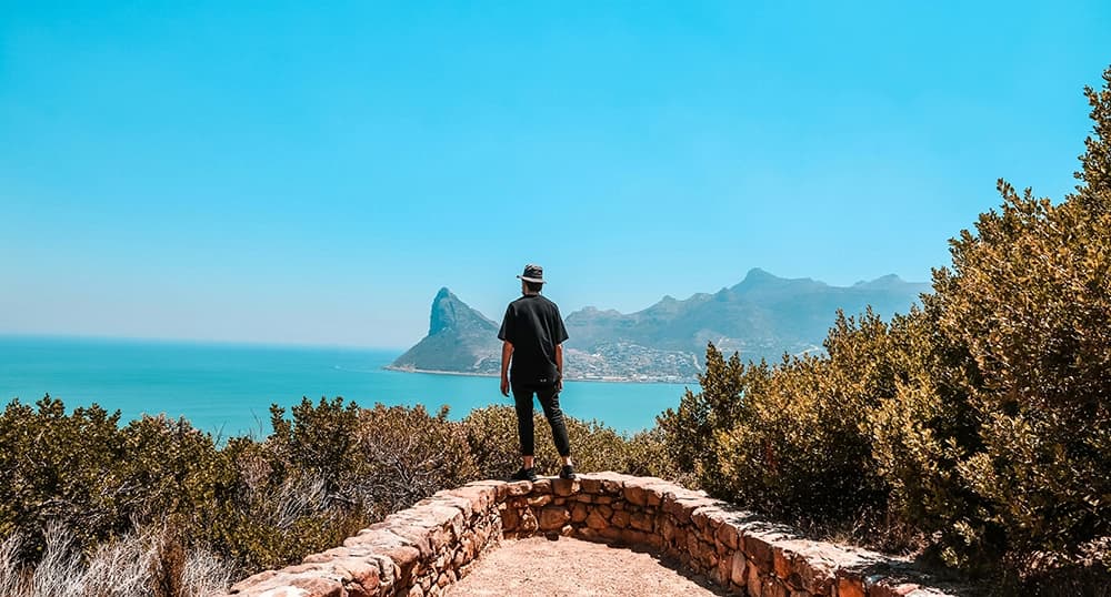 Man at beautiful looking out point at Chapmans Peak.