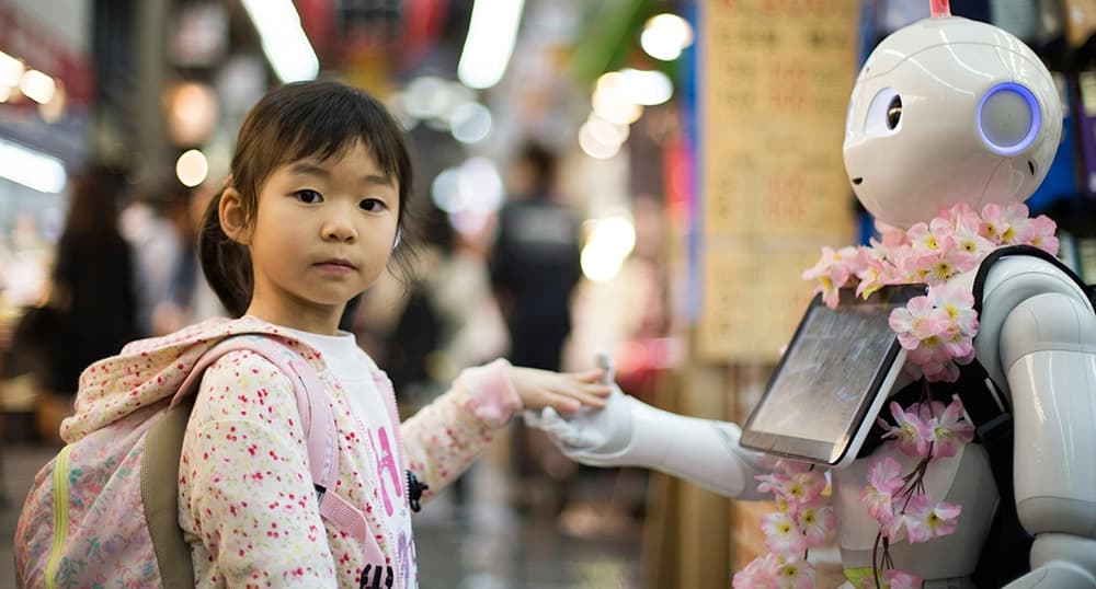Girl holding hands with a robot