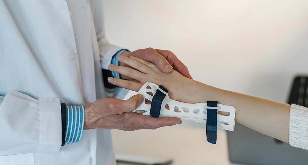 Patient getting a brace put on.