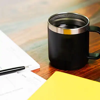 Coffee mug and notes.