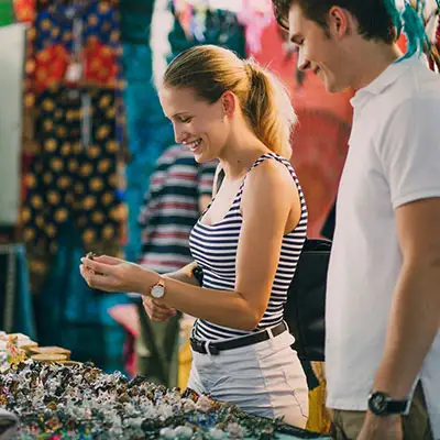 couple-looking-at-jewelry-in-market