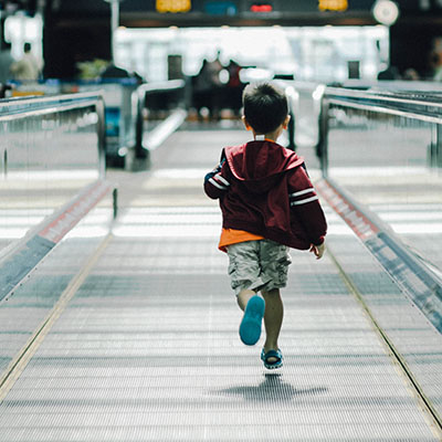 Child running in airport.