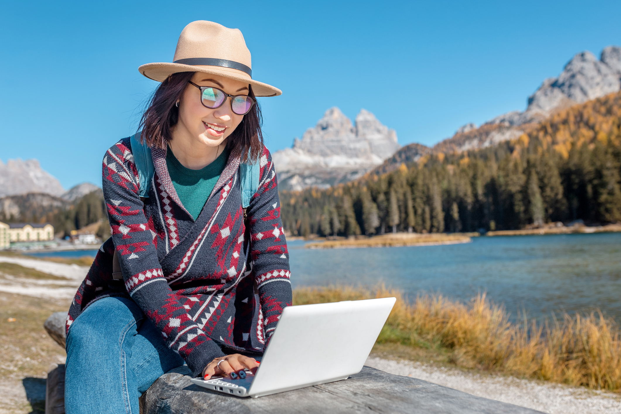 Woman with travel insurance types in the mountains