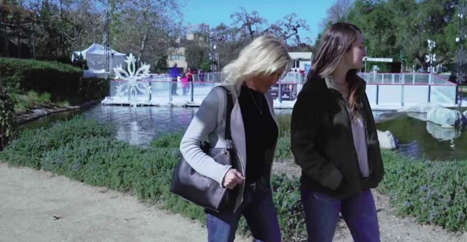 Two women walking in a park in Europe