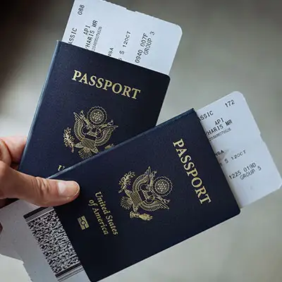 USA passports with airline tickets.