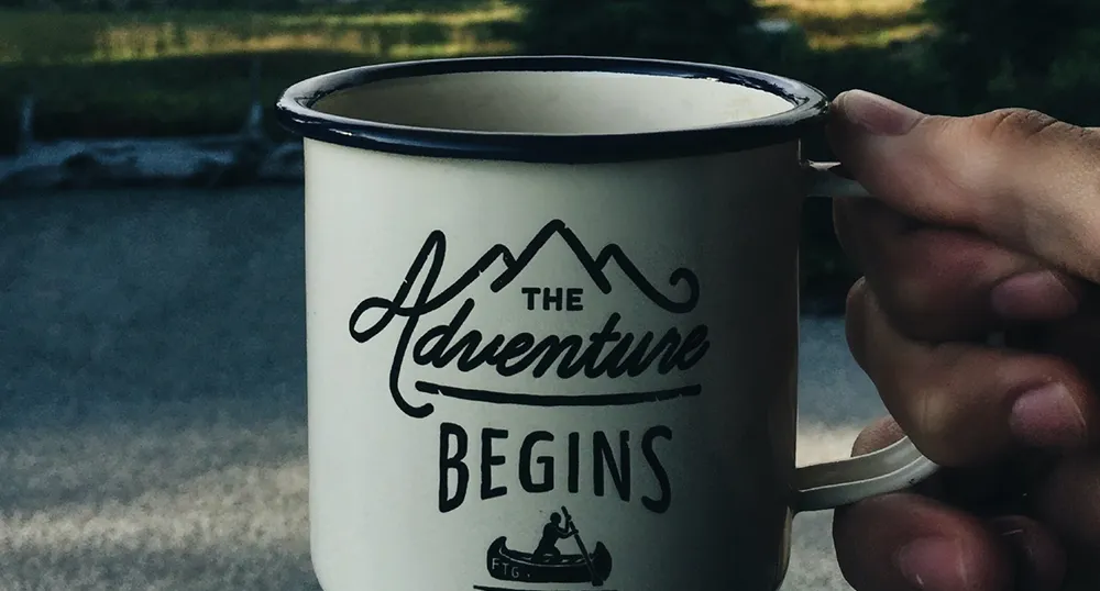 Drinking coffee, camping in the mountains.