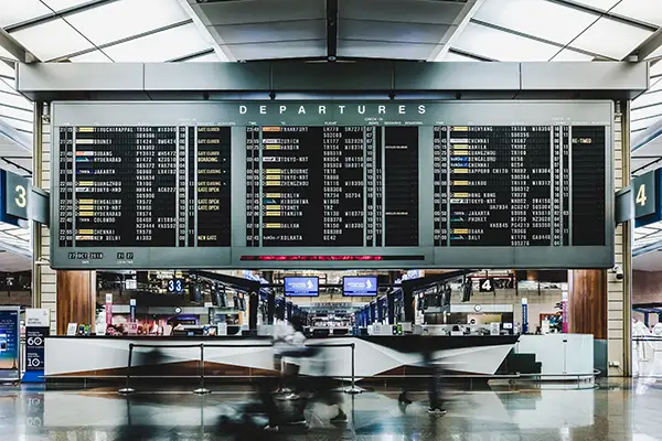 airport-departure-and-arrival-signs-in-terminal-trip-insurance