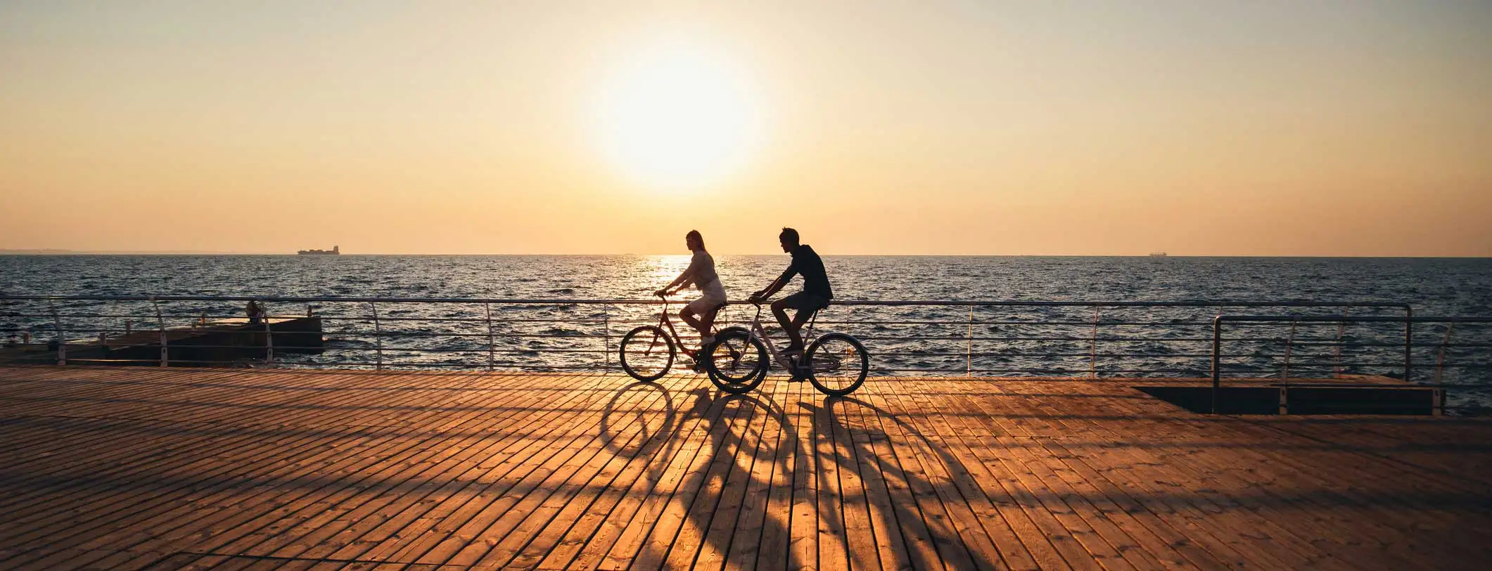 A-couple-with-travel-insurance-rides-bikes