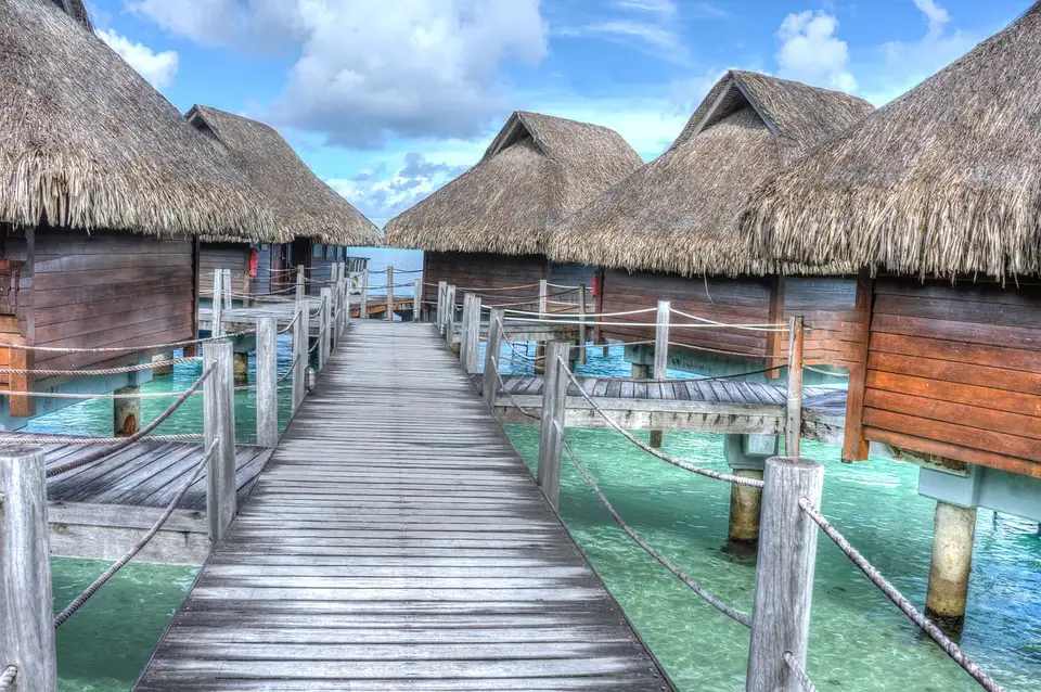 huts in clear water of Bora Bora